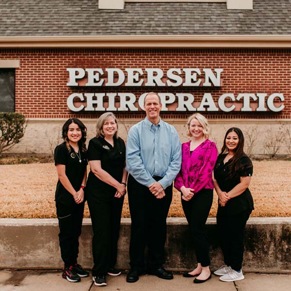 Chiropractor Pantego TX Jeffrey Pedersen and Bethany Meet the Team Group Photo